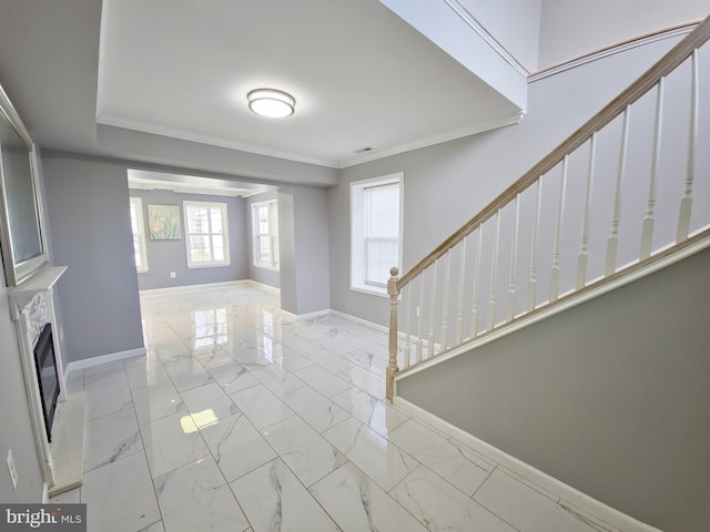 foyer featuring crown molding