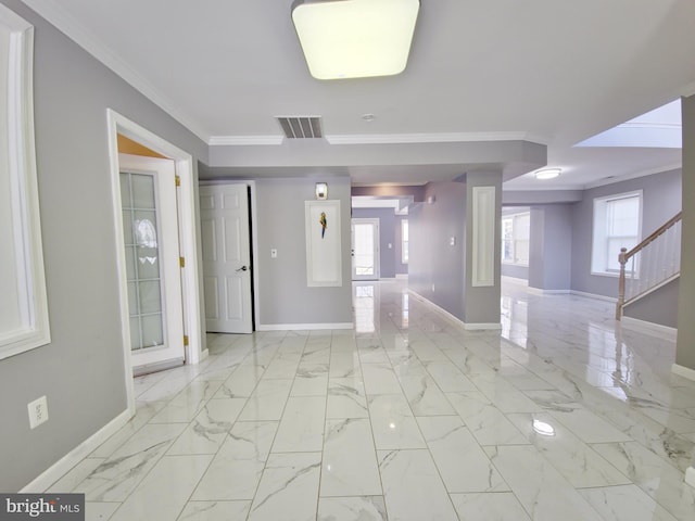 empty room featuring ornamental molding