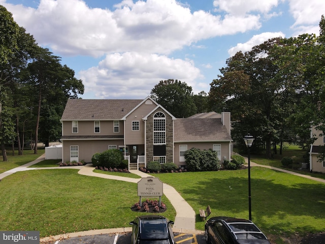 view of front of home with a front yard