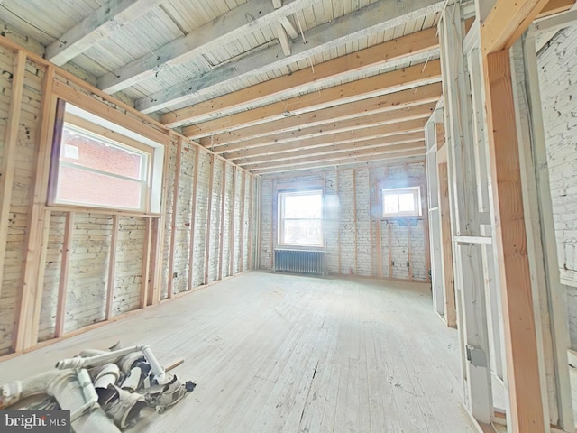 miscellaneous room featuring hardwood / wood-style floors and radiator heating unit