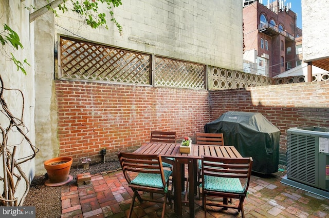 view of patio / terrace featuring cooling unit and area for grilling