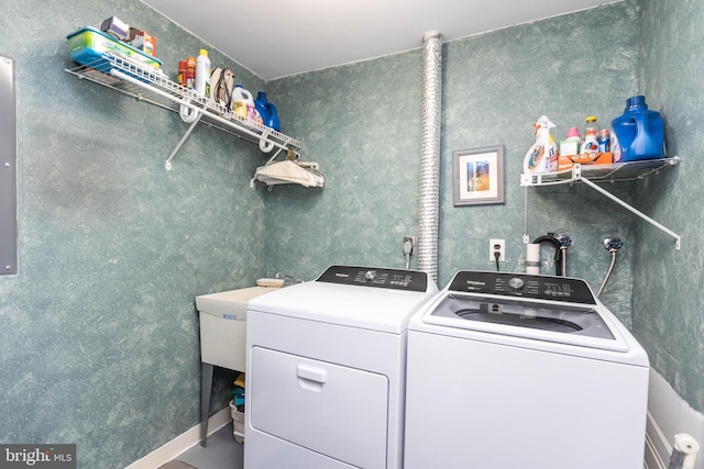 washroom with washer and dryer