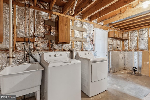 washroom featuring sink and washer and dryer