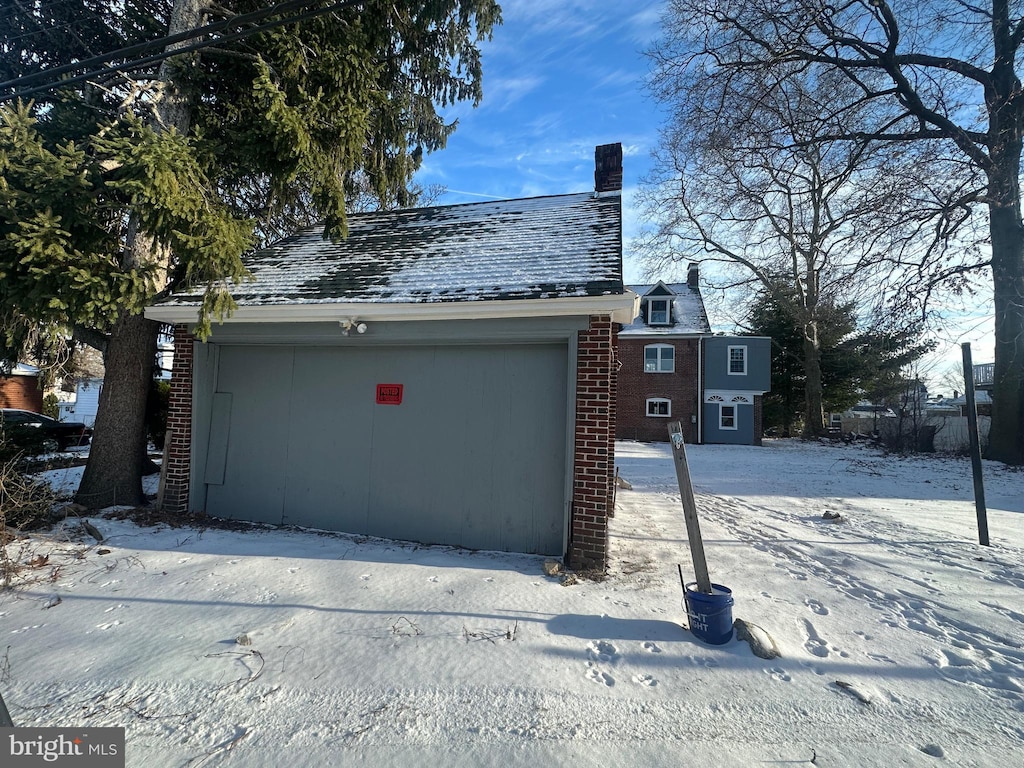 view of snow covered garage