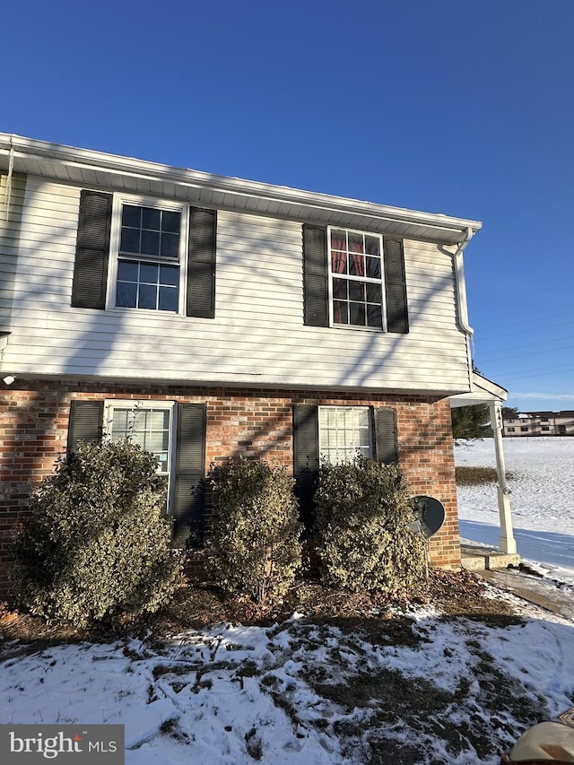 view of snow covered property