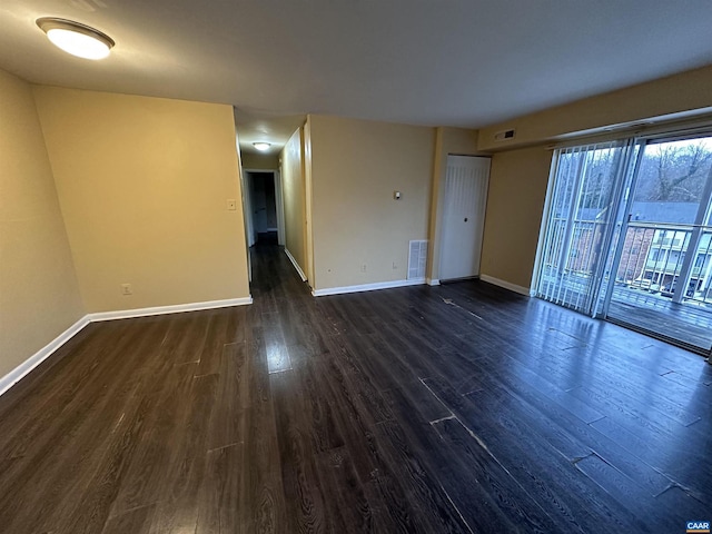 unfurnished room featuring dark hardwood / wood-style flooring