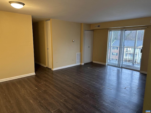 empty room featuring dark wood-type flooring