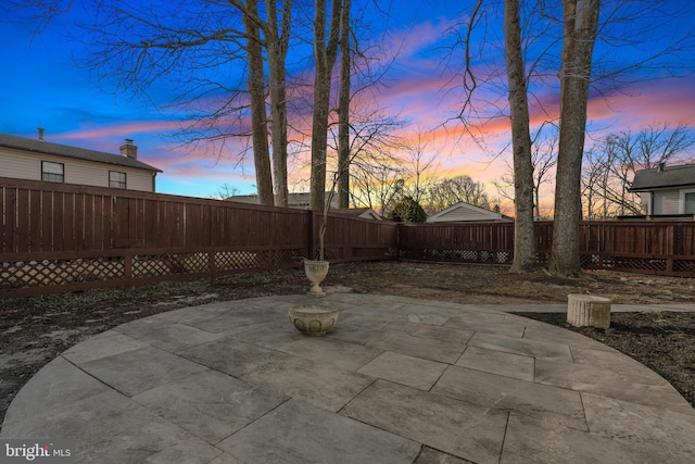 view of patio terrace at dusk