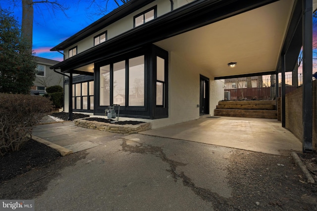 view of property exterior at dusk