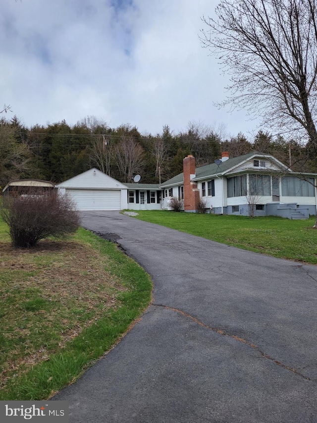 19712 Northwestern Pike, Shanks, WV 26761 - view of front facade with a garage and a front yard