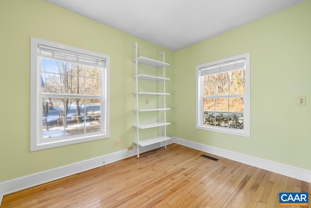 unfurnished room featuring light wood-type flooring