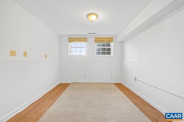 unfurnished room featuring hardwood / wood-style flooring