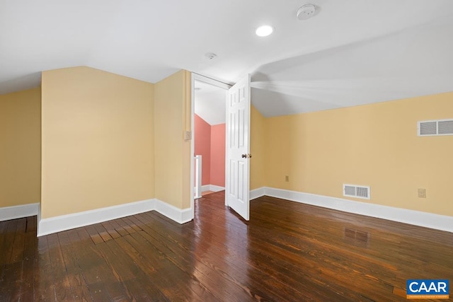 bonus room featuring lofted ceiling and dark hardwood / wood-style floors