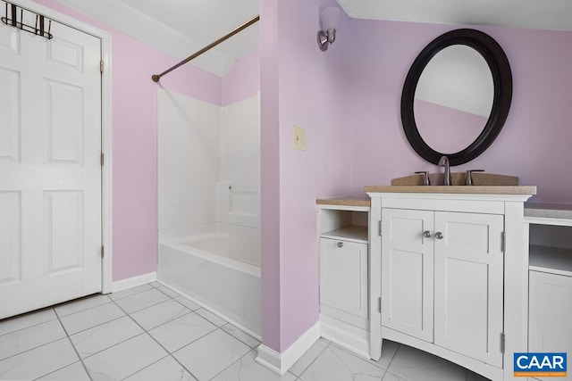 bathroom with vanity and  shower combination