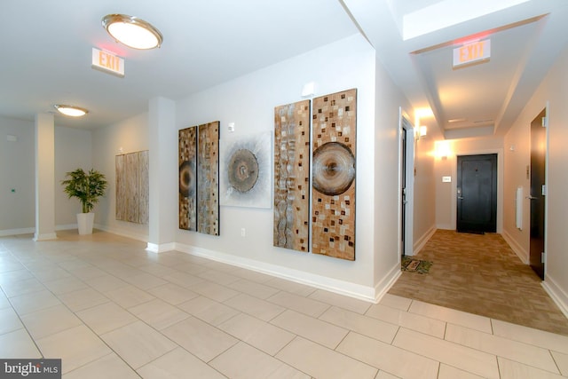 corridor with light tile patterned floors