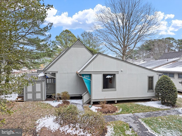 view of snow covered house