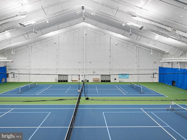 view of tennis court featuring basketball hoop