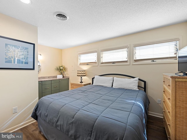 bedroom featuring a textured ceiling