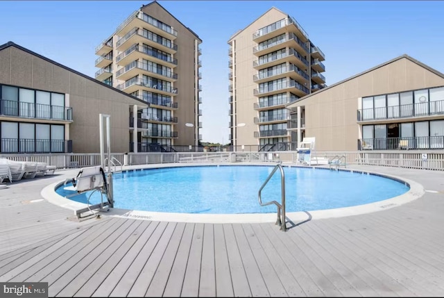 view of swimming pool with a patio area