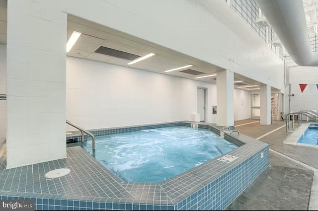 view of pool with an indoor in ground hot tub