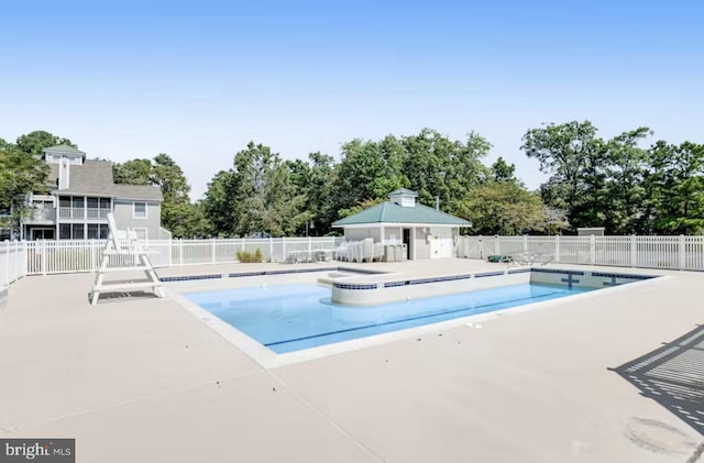 view of swimming pool with a patio