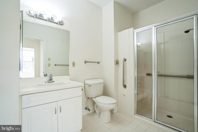 bathroom featuring an enclosed shower, vanity, tile patterned floors, and toilet