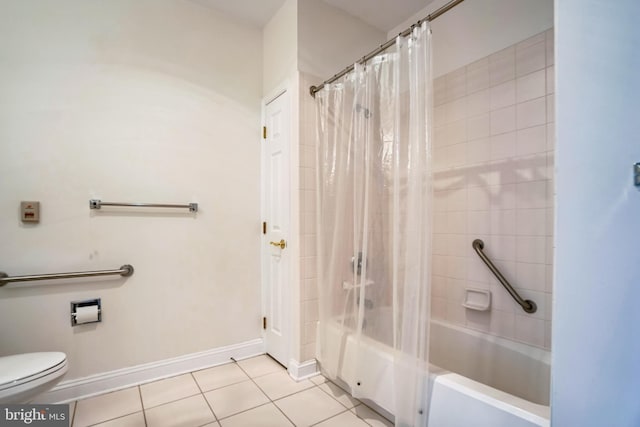 bathroom featuring tile patterned flooring, shower / bath combo, and toilet