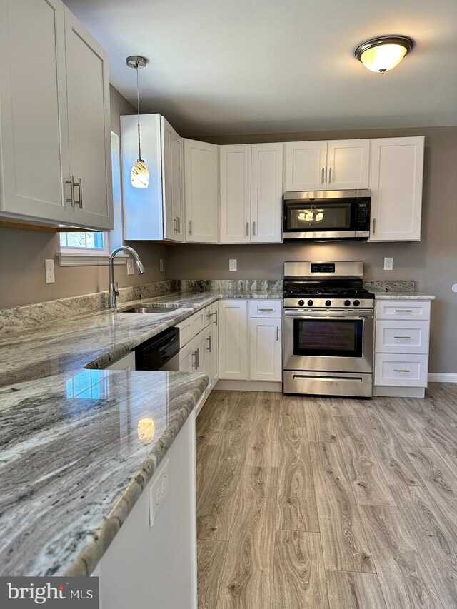 252 Stanger Ave, Glassboro, NJ 08028 - kitchen with sink, white cabinets, light stone counters, light hardwood / wood-style floors, and stainless steel appliances