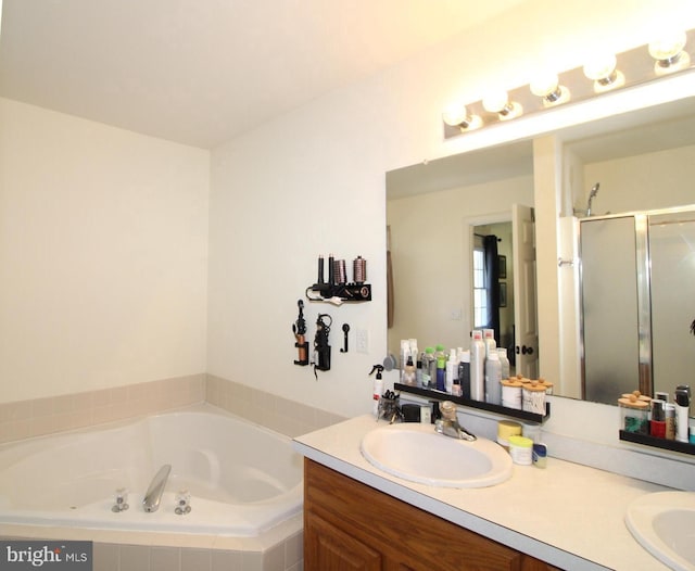 bathroom featuring independent shower and bath and vanity