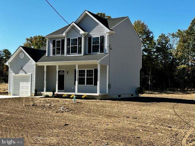 view of front of home featuring a garage and covered porch