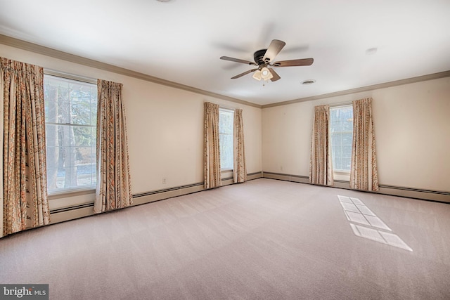 spare room with ornamental molding, light colored carpet, and ceiling fan