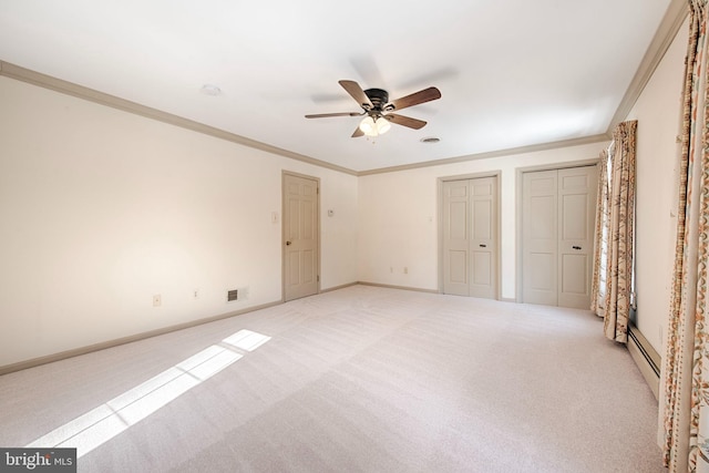 unfurnished bedroom with crown molding, ceiling fan, two closets, a baseboard radiator, and light colored carpet