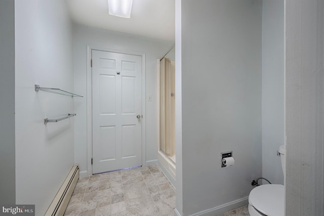 bathroom featuring a baseboard radiator, toilet, and a shower with shower door