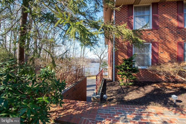 view of home's exterior featuring a water view