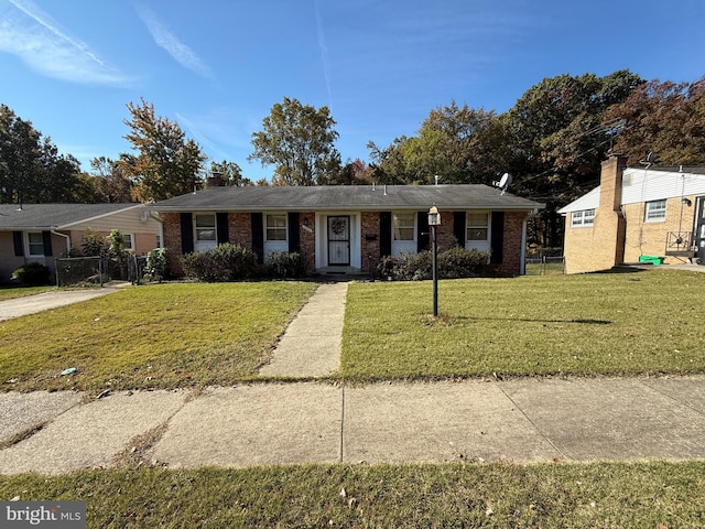 ranch-style home with a front yard