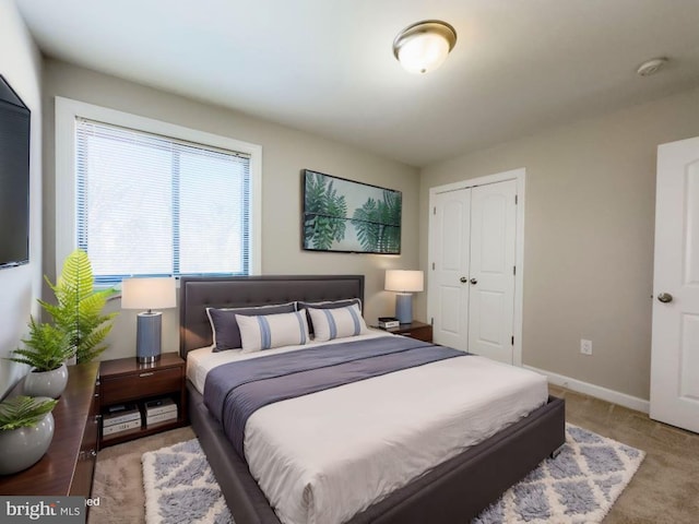 bedroom with carpet floors and a closet