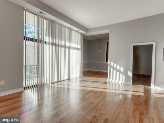 spare room featuring hardwood / wood-style floors