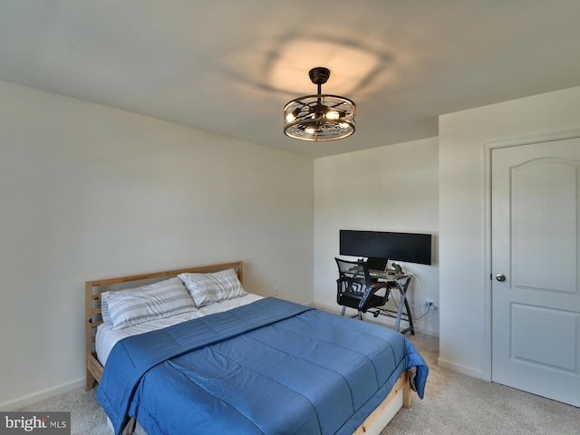 bedroom with baseboards and carpet floors