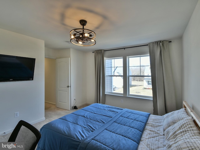 bedroom with carpet flooring and baseboards