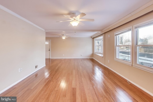 empty room featuring ornamental molding, ceiling fan, and light wood-type flooring