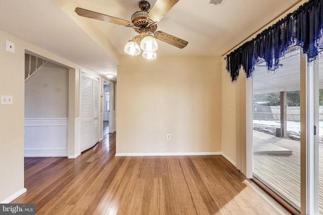 unfurnished dining area with ceiling fan and wood-type flooring