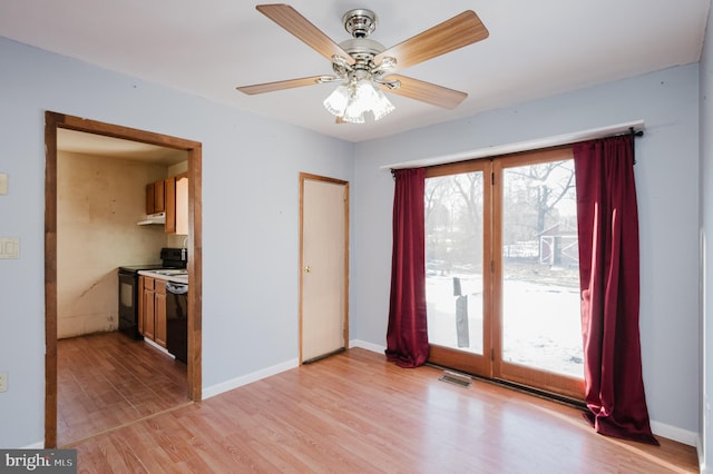 interior space featuring light hardwood / wood-style flooring and ceiling fan