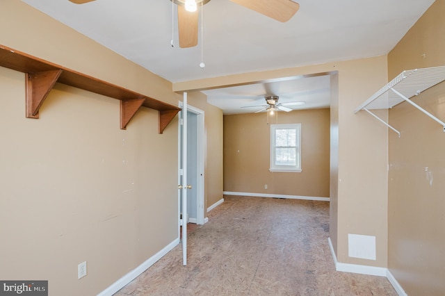 interior space with ceiling fan