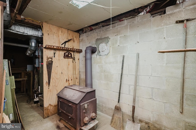 basement featuring a wood stove