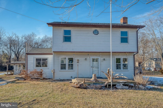 back of house with a yard