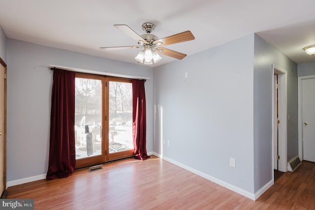 unfurnished room featuring ceiling fan and wood-type flooring