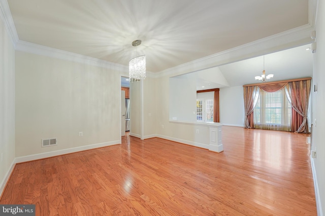 unfurnished room with light wood-type flooring, crown molding, vaulted ceiling, and a notable chandelier