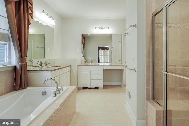 bathroom with tile patterned floors, vanity, and plus walk in shower