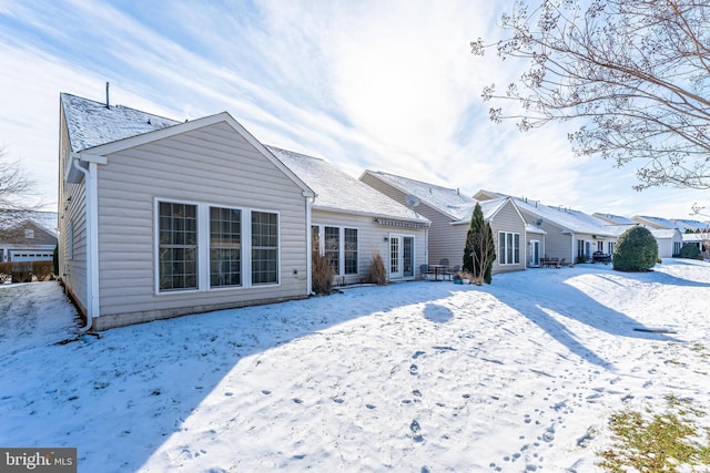 view of snow covered house