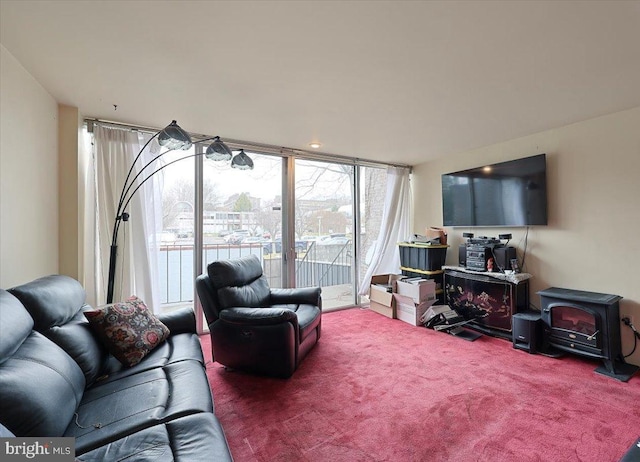 carpeted living room featuring a wood stove